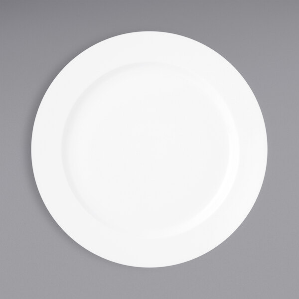 A Oneida Verge warm white porcelain plate on a gray surface.