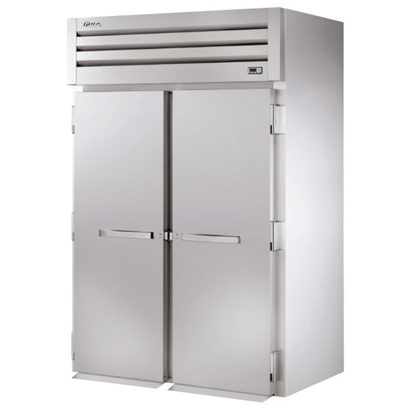 A stainless steel True reach-in refrigerator with two solid doors.