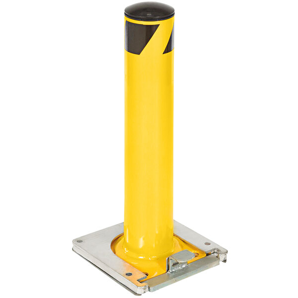 A yellow steel safety bollard with a metal base.
