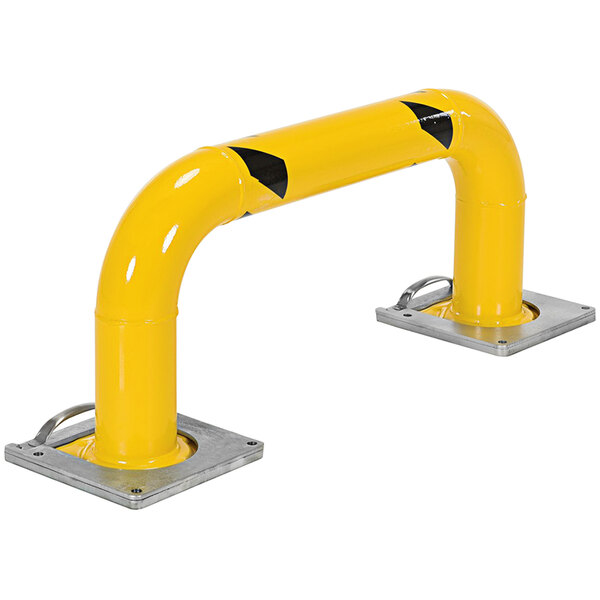 A yellow metal safety guard with black and yellow stripes.