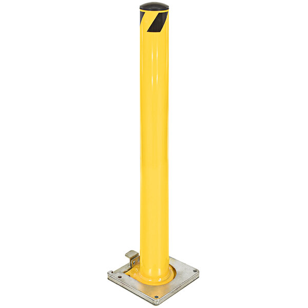 A yellow steel safety bollard with a black and yellow stripe on it.