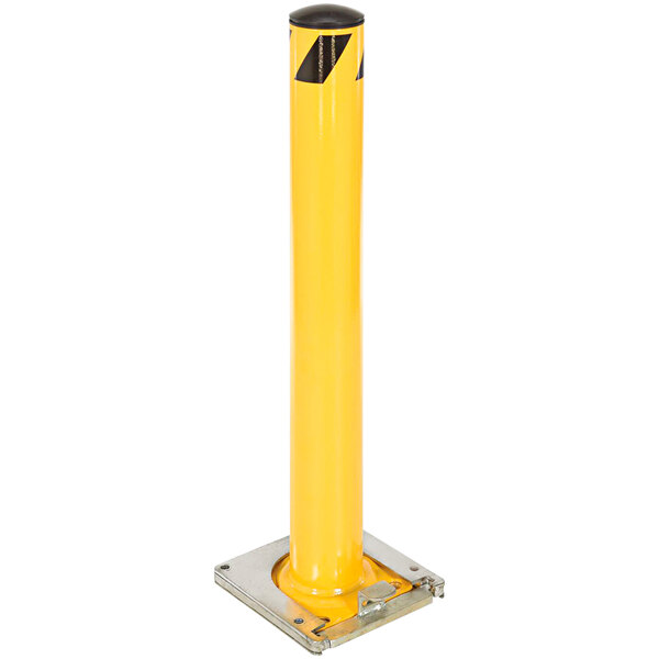 A yellow steel safety bollard with black stripes on a metal frame.
