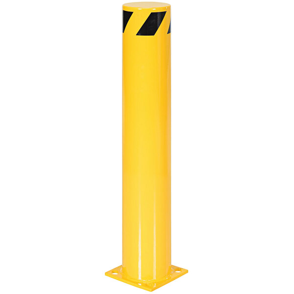 A yellow steel bollard with black stripes on the top.