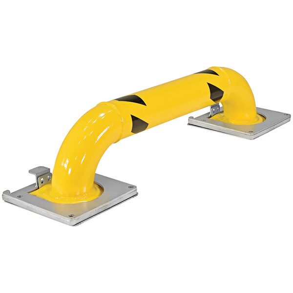 A yellow metal Vestil machinery guard with black and yellow markings.