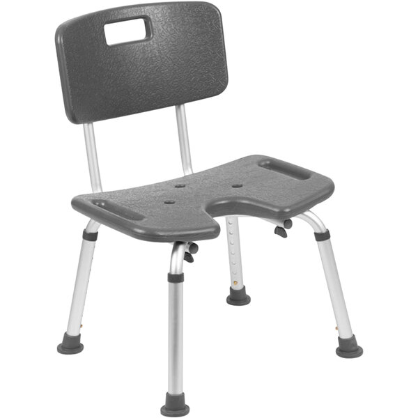A gray plastic shower chair with a back and U-shaped cutout.