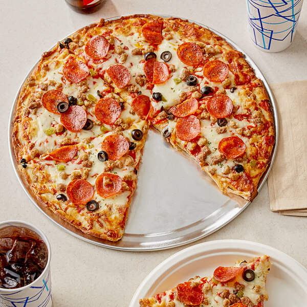 A Papa Primo's large supreme pizza with meat and olives on a tray.