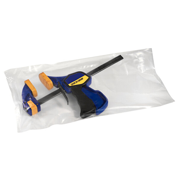 A clear plastic bag holding a blue and black tool.