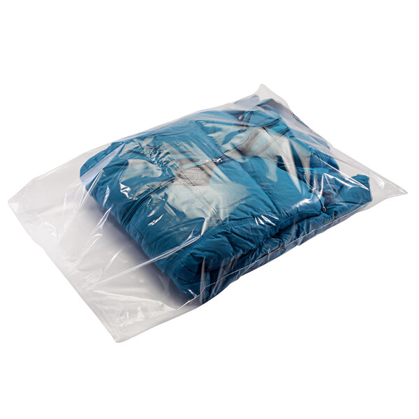 A blue jacket in a clear flat poly bag.