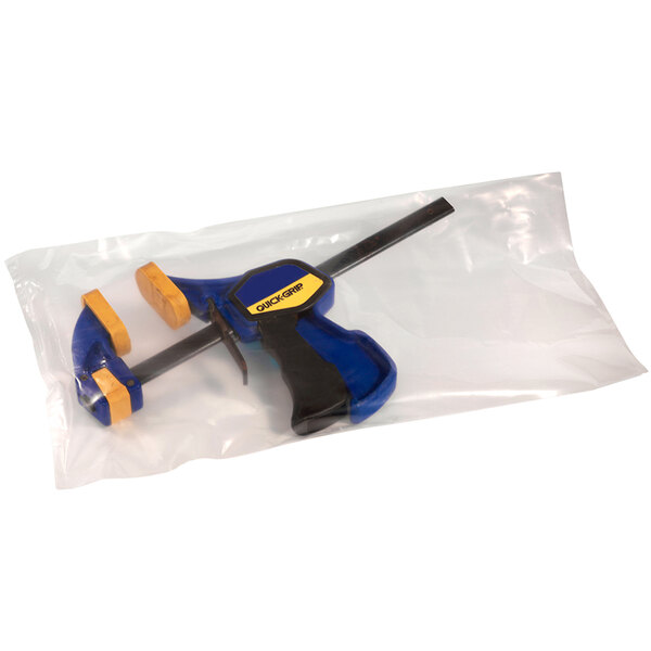 A clear plastic bag with a blue and yellow tool inside.