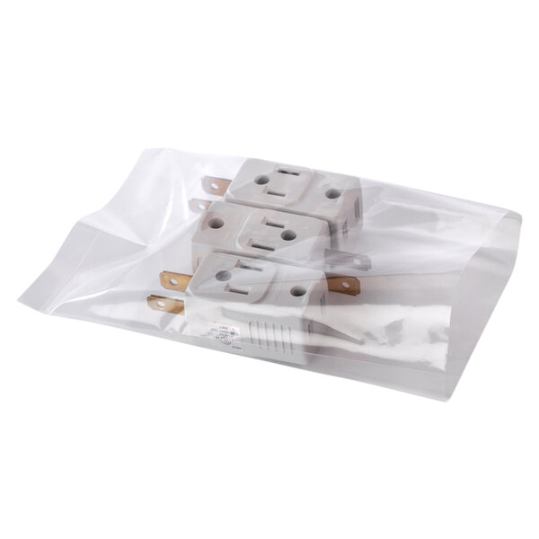 A clear poly bag filled with electrical plugs.