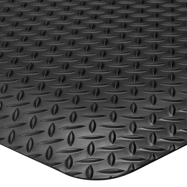 A black rubber anti-fatigue mat with a diamond pattern.