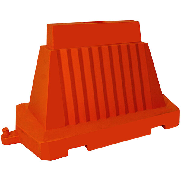 An orange plastic wall barricade with a red stripe.