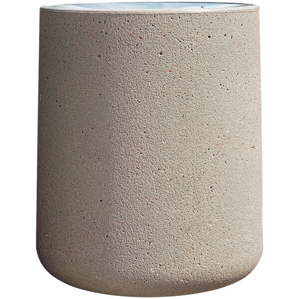 A white cylinder shaped Wausau Tile concrete trash receptacle with an aluminum funnel lid.