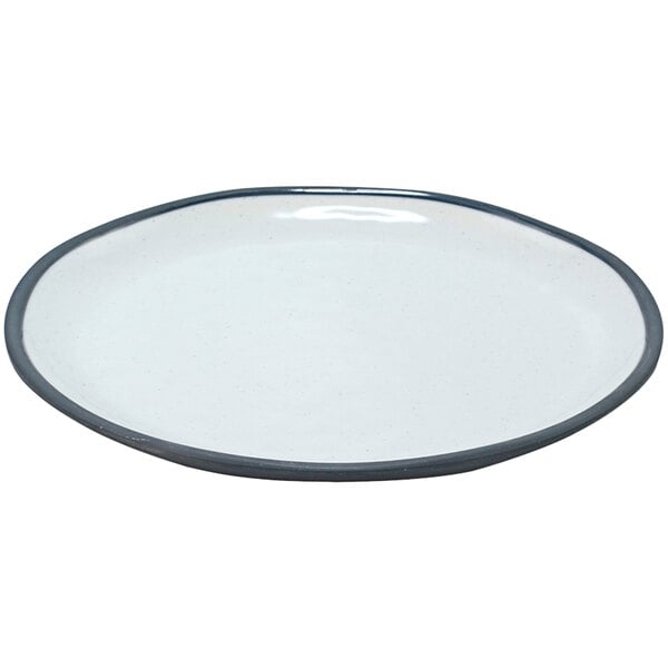 A white plate with a blue rim and a black rim.