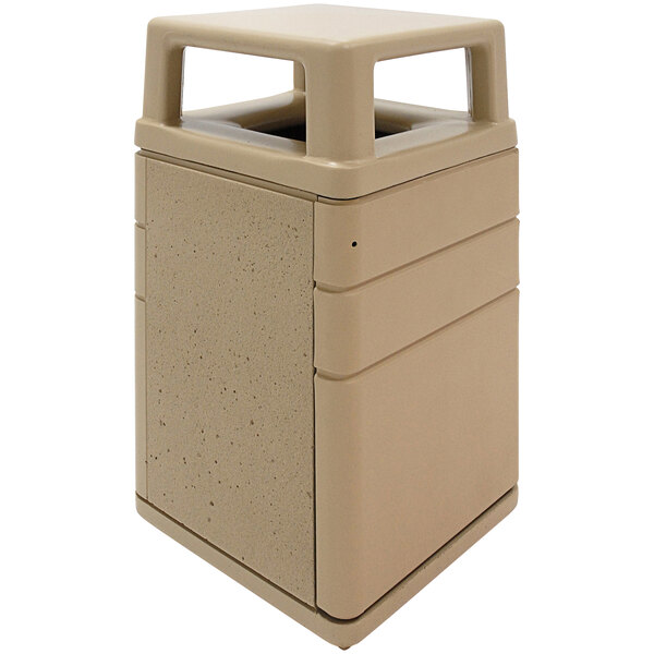 A tan rectangular Wausau Tile concrete trash receptacle with a 4-way lid.