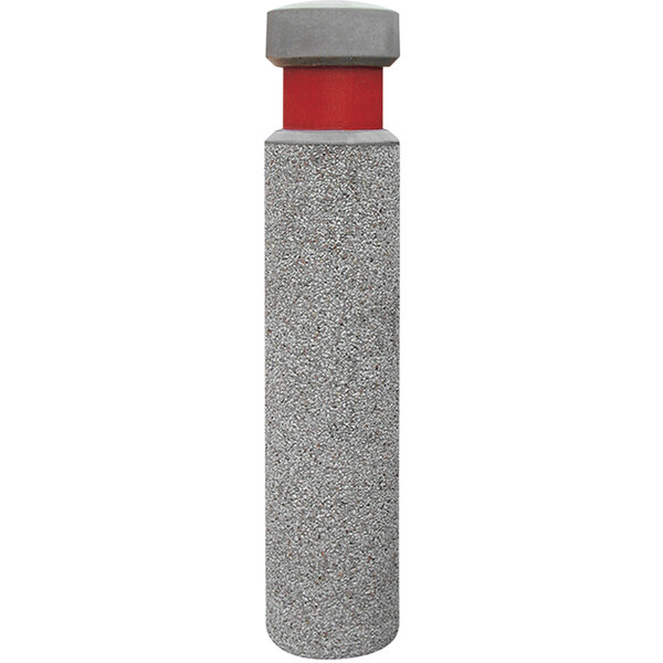A grey concrete cylinder with a red cap on top.