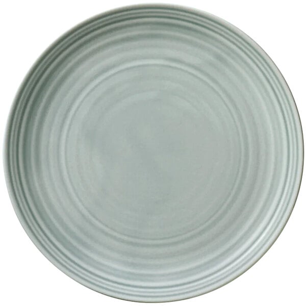 A white plate with a circular pattern on the rim.