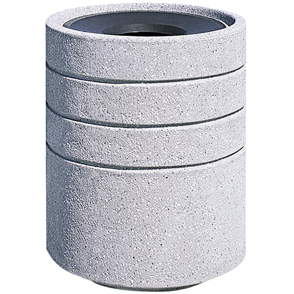 A white Wausau Tile round concrete trash receptacle with a black aluminum funnel top.