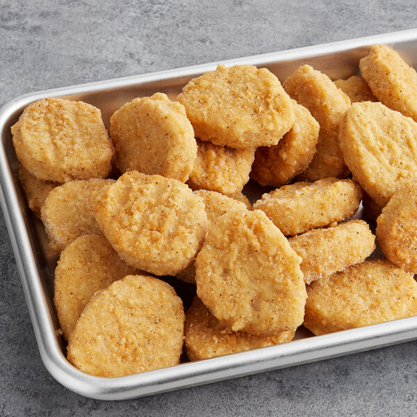 A tray of Rebellyous vegan plant-based chicken nuggets on a table.
