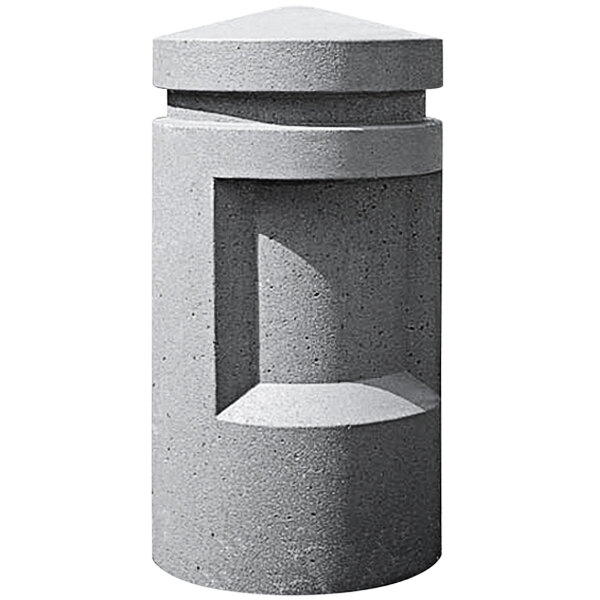 A Wausau Tile round concrete bollard with a triangular top.