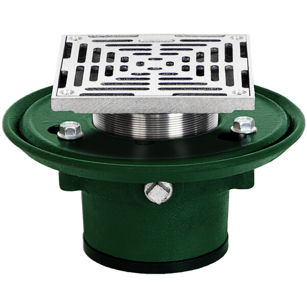 A green and silver metal Josam floor drain with a metal grate.