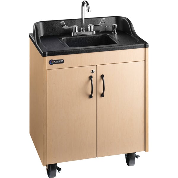 An Ozark River Manufacturing portable hot water hand sink with a black laminate counter top on wheels.
