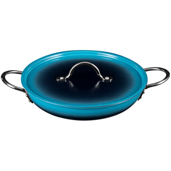 A Bon Chef ombre Caribbean blue saute pan with a metal handle and lid.