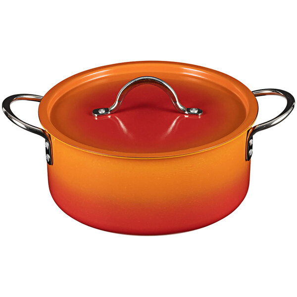 A Bon Chef Country French Tangerine sauce pot with a handle and cover.