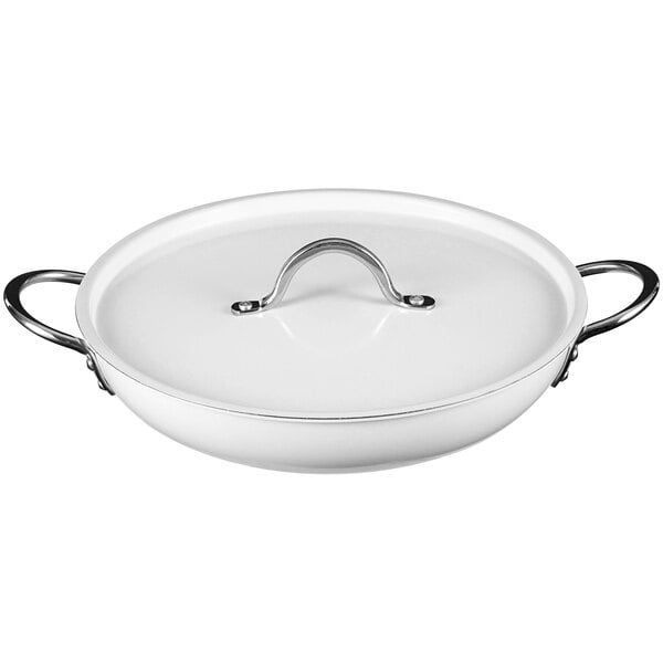 A white saute pan with a handle.
