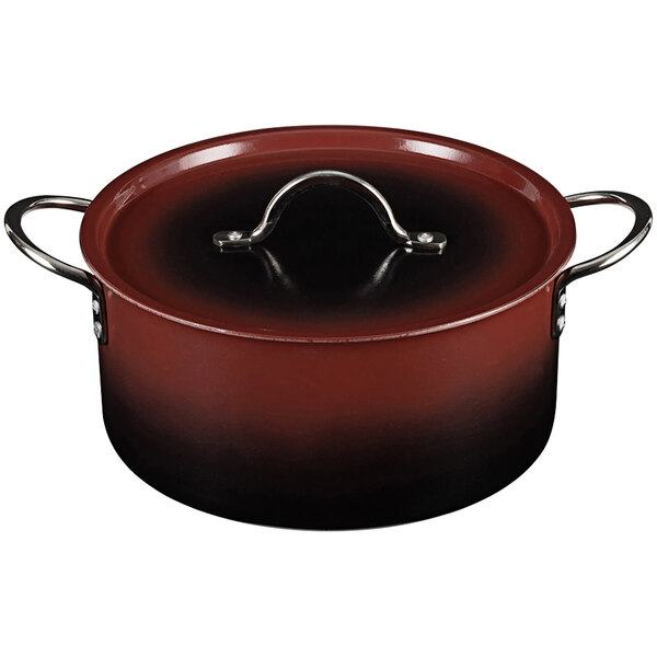 A Bon Chef Country French Ombre Merlot sauce pot with a black liquid inside and a cover.