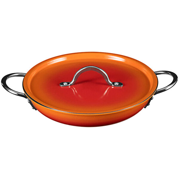 A Bon Chef Country French Ombre Tangerine saute pan with a handle and cover.