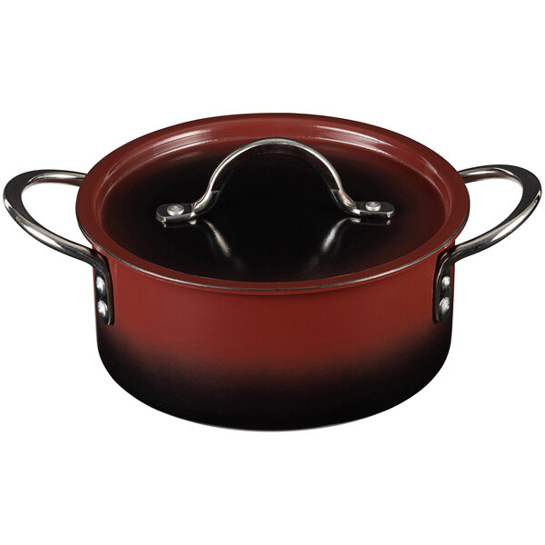 A red Bon Chef sauce pot with a metal handle.