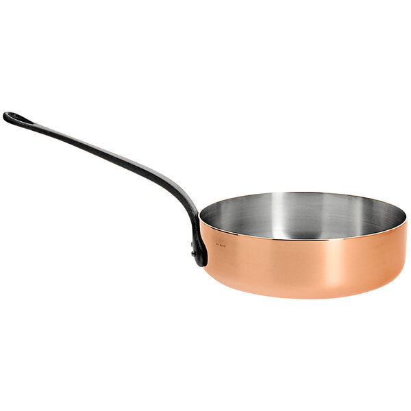 A de Buyer copper saute pan with a black handle.
