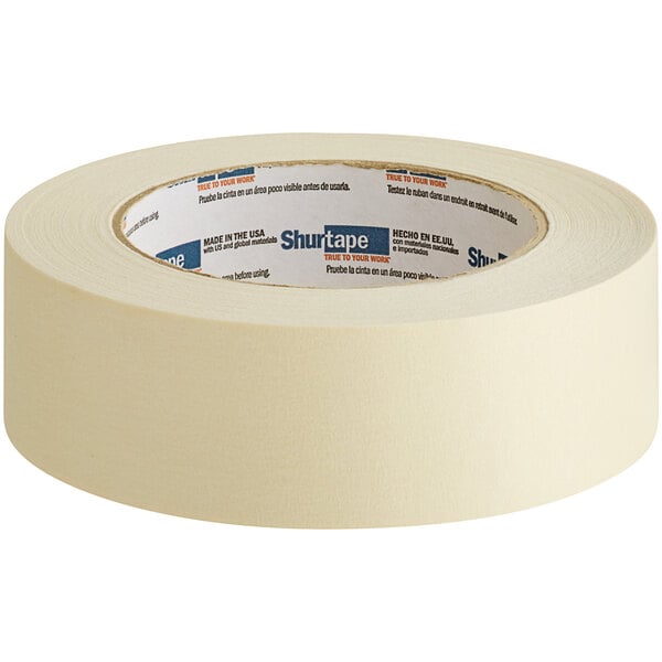 A roll of Shurtape natural masking tape with text on it.