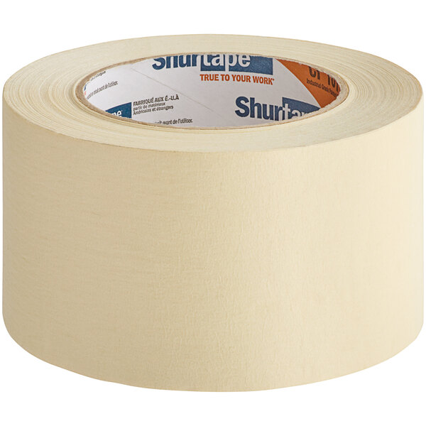 A roll of Shurtape natural masking tape with a blue and red label on a white background.