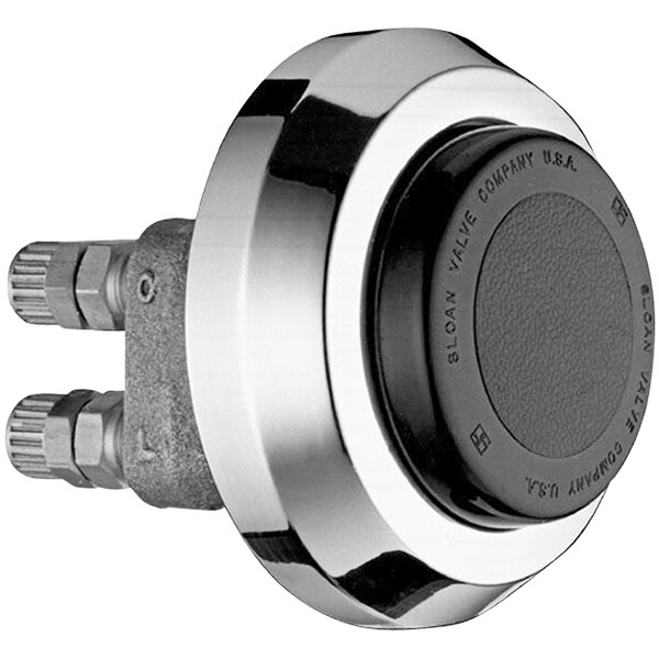 A Sloan hydraulic actuator wall fixture with a black circle on a round metal object.