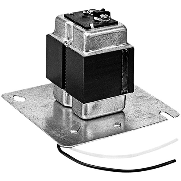 A metal square with black and white metal parts and wires attached.
