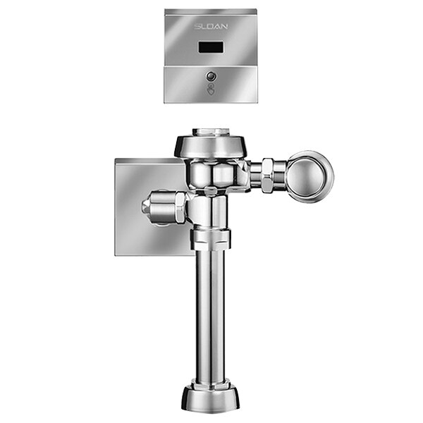 A silver metal Sloan water closet flushometer with a button.