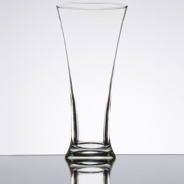 A Libbey customizable pilsner glass on a table.