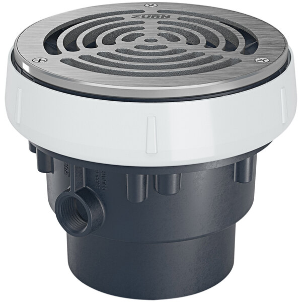 A Zurn EZ1 ABS floor drain with a round stainless steel cover.