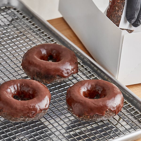 Chocolate Devil's Food cake donuts on a cooling rack.