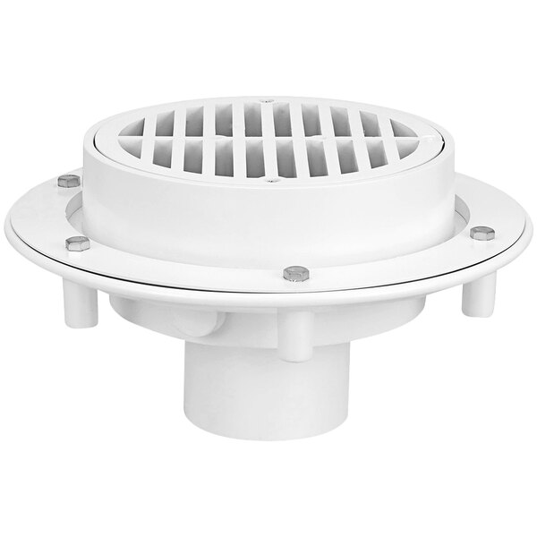 A Zurn PVC floor drain with a round white grate over a round base.