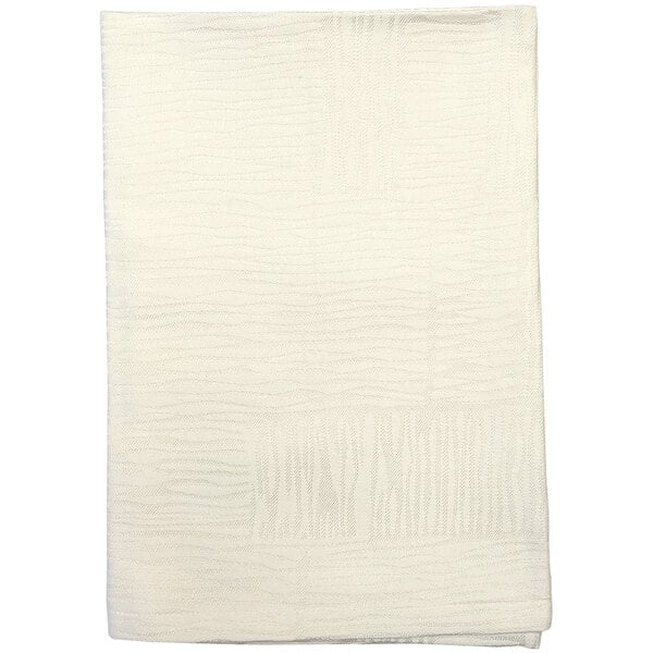 A folded white Garnier-Thiebaut cloth napkin with a pattern.