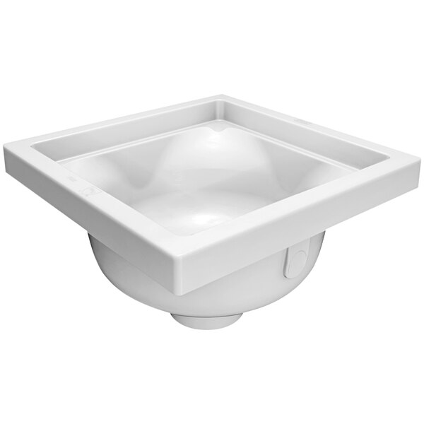 A white Zurn polymer floor sink with a square top and drain in it.