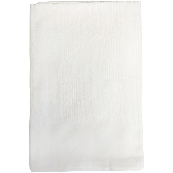A white Garnier-Thiebaut cloth napkin with a small textured edge.