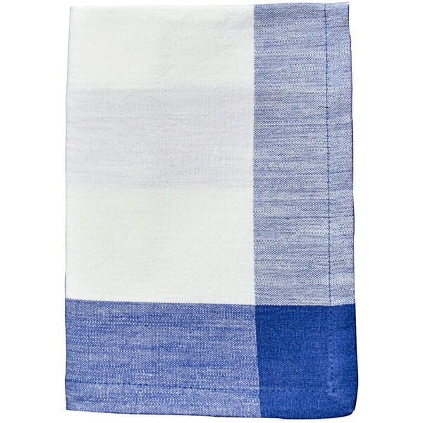 A close up of a blue and white plaid Garnier-Thiebaut cloth napkin.