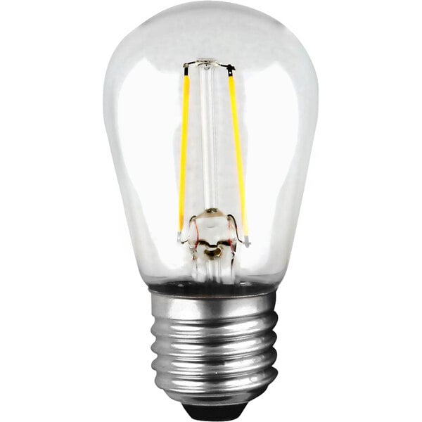 A close-up of a Clear S14 light bulb with a filament.