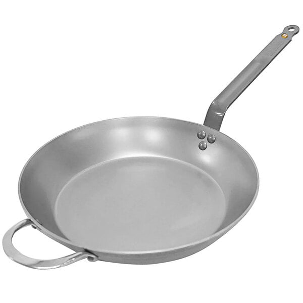 A de Buyer carbon steel frying pan with helper handle.