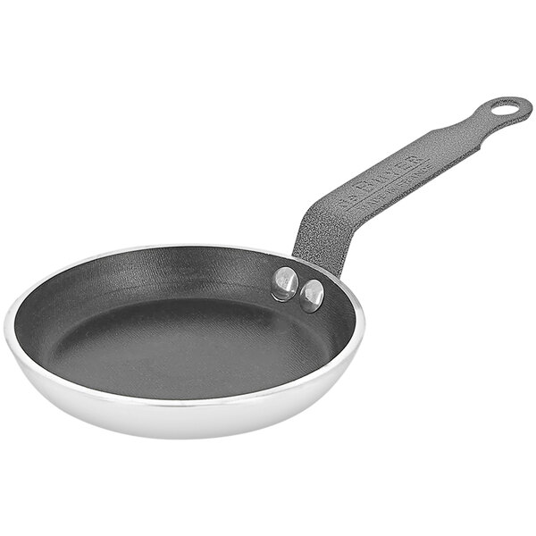 A black de Buyer Choc pancake pan with a handle.
