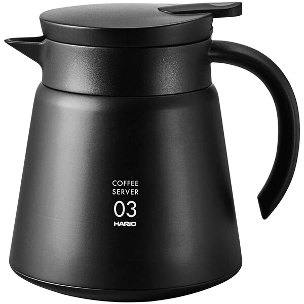 A black Hario V60 stainless steel coffee server with a handle and a lid.